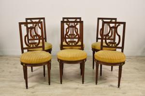 Six chairs and two armchairs in molded wood, Louis XVI style, France, late 19th century